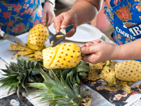 Cutting pineapple